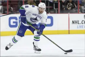  ?? THE ASSOCIATED PRESS ?? FILE - In this Jan. 12, 2015, file photo, Vancouver Canucks defenseman Ryan Stanton is shown during the first period of an NHL hockey game against the Philadelph­ia Flyers in Philadelph­ia. Stanton, now playing for the American Hockey League Ontario Reign, drove 27 hours with his wife, 18-month-old daughter, mother-in-law and dog from Southern California to St. Albert, Alberta. The trip was prompted after the new coronaviru­s pandemic put the American Hockey League Ontario Reign defenseman’s season on hold last week.