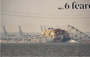  ?? (AFP) ?? AFTERMATH – Part of the steel frame of the Francis Scott Key Bridge sits on top of the container ship Dali after the bridge collapsed in Baltimore, Maryland, on Tuesday, March 26, 2024.