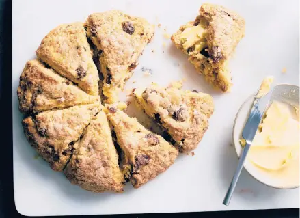  ?? DAVID MALOSH/THE NEW YORK TIMES ?? Dotted with dried berries and baked into a round, this strawberry scone loaf emerges from the oven full of jammy bites.