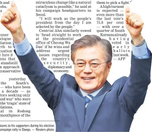  ?? — Reuters photo ?? Moon gestures to his supporters during his election campaign rally in Daegu.