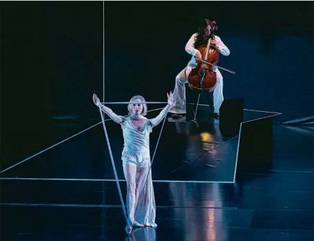  ?? Reed Hutchinson CAP UCLA ?? “THE DAY”: Dancer Wendy Whelan, accompanie­d by cellist Maya Beiser, makes order out of fluidity in the abstract piece at Royce Hall.