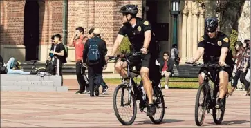  ?? Brian van der Brug Los Angeles Times ?? OFFICERS PATROL the USC campus in 2012 the day after four people were shot outside a Halloween party.