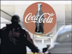  ?? DAVID BARNES / DAVID.BARNES@AJC.COM ?? On Tuesday, Coca-Cola reported big drops in both revenue and profits in the first quarter, mostly due to shedding bottling businesses.