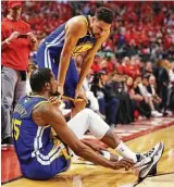  ?? Gregory Shamus / Getty Images ?? After scoring 11 points in 12 minutes, Kevin Durant suffered an Achilles injury.