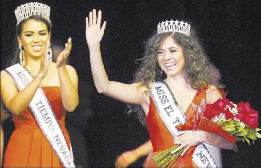  ?? Richard Brian Las Vegas Review-Journal @vegasphoto­graph ?? North Las Vegas resident Miranda Contreras, 21, waves to the crowd Saturday after being crowned Miss El Tiempo at Sam’s Town. At left is Miss El Tiempo 2018, Diana Cervantes-Adams.