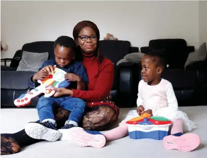  ?? ?? ‘I believed I’d lost my entire family,’ Perpetual Uke with twins Pascal, left, and Palmer. Photograph: Stephen Burke/The Guardian