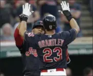  ?? TONY DEJAK — ASSOCIATED PRESS ?? Edwin Encarnacio­n is congratula­ted by Michael Brantley, right, after Encarnacio­n hit a two‑run home run off Rays starter Jake Odorizzi during the sixth inning May 16.