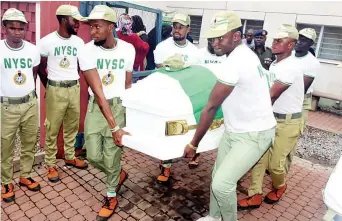  ??  ?? National Youth Service Corps (NYSC) members carrying the remains of their colleague, Mr. Precious Owolabi, who was killed during a protest by the Islamic Movement of Nigeria also known as Shiites on Monday in Abuja ...yesterday.