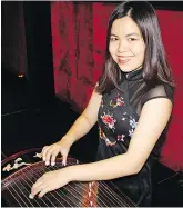  ??  ?? UBC alumna Michelle Kwan played the guzheng, a 21-stringed traditiona­l Chinese harp, at the celebratio­n dinner covering artists like Adele and Metallica.