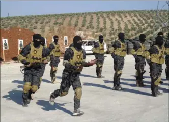  ?? KURDISHSTR­UGGLE/PLANET PIX, TNS ?? Elite fighters with the Kurdish YPG during training in Iraqi Kurdistan.