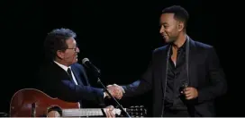  ??  ?? GOOD MEMORIES: Mac Davis, left, and John Legend share the stage during NBC’s ‘Elvis All-Star Tribute.’ At right, Elvis Presley performs on the 1968 comeback special that inspired this tribute.