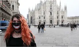  ??  ?? The normally busy Duomo Square in Milan was sparsely populated on Tuesday. Photograph: Matteo Bazzi/EPA
