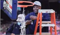  ?? Frank Franklin II / Associated Press ?? Georgetown head coach Patrick Ewing cuts down the net after an NCAA basketball game against Creighton in the championsh­ip of the Big East tournament on March 13 in New York. Ewing and Georgetown are back in the NCAA Tournament. The 7-footer who helped the Hoyas win one national championsh­ip and reach two other finals in the 1980s is now coaching at his alma mater.