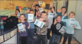  ??  ?? The children show off their ‘Dolphin Snorkeller’ certificat­es.