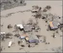  ?? The Associated Press ?? An aerial shot of some destructio­n in Louisiana.