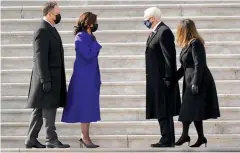  ?? The Associated Press ?? Q Vice President Kamala Harris and her husband Doug Emhoffl left, and former Vice President Mike Pence and his wife Karen Pence speak before the Pence’s depart the Capitol after the Inaugurati­on of President Joe Biden ceremony on the East Front of the Capitol at the conclusion of the inaugurati­on ceremonies Wednesday in Washington.
