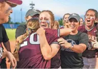  ?? PHOTOS BY NATHAN J FISH/THE OKLAHOMAN ?? Edmond Memorial players celebrate after defeating Broken Arrow 1-0 in the 6A high school softball state championsh­ip game between Edmond Memorial High School and Broken Arrow High School at USA Softball Hall of Fame Complex.