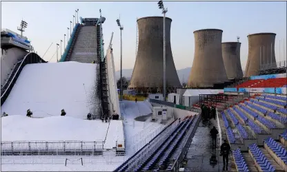  ?? ?? IT’LL BE ALL WHITE ON THE NIGHT:
The half-covered snowboardi­ng venue built in the industrial heart of Beijing