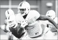  ??  ?? Tennessee freshman Jauan Jennings returns a punt during practice. Jennings is a former quarterbac­k who just switched to wide receiver this summer. AMY SMOTHERMAN BURGESS KNOXVILLE NEWS SENTINEL