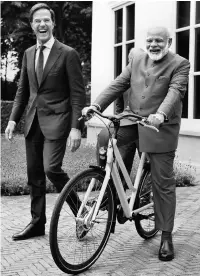 ?? PTI ?? Prime Minister Narendra Modi (right) tries out a bicycle gifted by Dutch Prime Minister Mark Rutte in The Hague, Netherland­s, on Tuesday