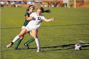  ?? LUIS SÁNCHEZ SATURNO/THE NEW MEXICAN ?? Aztec’s Autum Roundy, front, challenges the ball from Los Alamos’ Alissia Haagenstad during their Class 4A state quarterfin­al Wednesday at the New Mexico Soccer Tournament Complex.