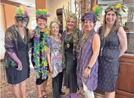  ?? ?? A 15-year GFWC board member is surrounded by family members at the GFWC Woman's Club of Indio's annual fundraiser on March 2, 2024.