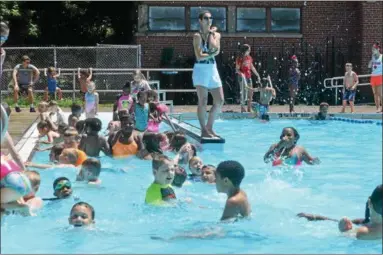  ?? NICHOLAS BUONANNO-NBUONANNO@TROYRECORD.COM ?? Veterans Memorial Swimming Pool in Watervliet fills up quickly for its opening day Monday afternoon.