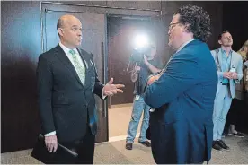  ?? SEAN KILPATRICK THE CANADIAN PRESS ?? Jim Balsillie, Council of Canadian Innovators, left, talks with Colin McKay, Google Canada, at a Commons privacy and ethics committee in Ottawa on Thursday.