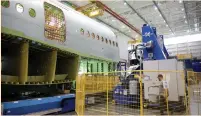  ?? (Jason Redmond/Reuters) ?? A MACHINE used in the Fuselage Automated Upright Build and mid-bodies production is seen at Boeing’s production facility in Everett, Washington, on June 1.