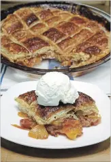  ??  ?? Peach Potpie with vanilla bean ice cream.