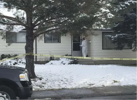  ??  ?? Police in protective suits were investigat­ing at a Rundle Heights home on Saturday afternoon following the death of 56-year-old Christophe­r Michael Antoniuk there the night before.