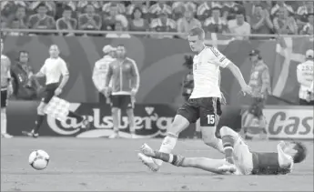  ??  ?? Germany’s Lars Bender scores his side’s second goal during a Euro 2012 Group B match against Denmark in Lviv, Ukraine, on Sunday.