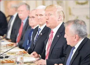  ?? Mandel Ngan AFP/Getty Images ?? PRESIDENT TRUMP at a lunch with Japan’s prime minister, who received little encouragem­ent on trade.