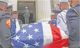  ?? AP PHOTO/JULIE BENNETT ?? Alabama Gov. Kay Ivey places her hand over her heart as the body of Congressma­n John Lewis arrives to the Alabama Capitol on Sunday in Montgomery, Ala.