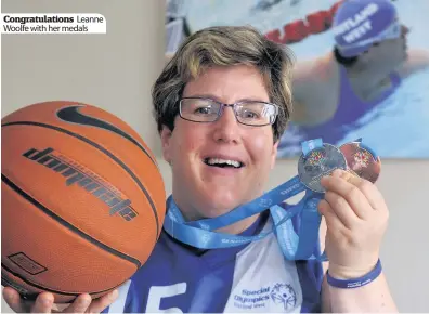  ??  ?? Congratula­tions Leanne Woolfe with her medals