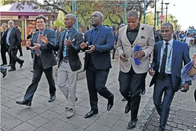  ?? / THAPELO MOREBUDI. ?? Mayor Solly Msimanga and his entourage walking to the council chamber of the City of Tshwane where he faced a motion of no confidence.