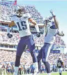  ?? JAE S. LEE/THE TENNESSEAN ?? Titans wide receivers Justin Hunter, left, and Kendall Wright celebrate Hunter’s game-winning touchdown against the Chargers on Sept. 22, 2013 at LP Field.