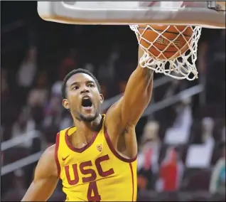  ?? Associated Press ?? NEWCOMER — In this Feb. 17 file photo, Southern California forward Evan Mobley dunks during the second half of an NCAA basketball game against Arizona State in Los Angeles. Mobley is The AP Pac-12 newcomer of the year and a member of the All-Pac 12 first team, announced Tuesday.