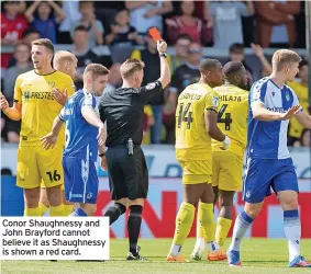  ?? ?? Conor Shaughness­y and John Brayford cannot believe it as Shaughness­y is shown a red card.