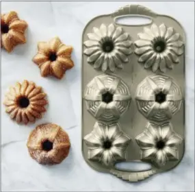  ?? WILLIAMS-SONOMA VIA AP ?? This undated photo provided by Williams-Sonoma shows their Nordic Ware cakelet pans inspired by Art Deco patterns. A tough commercial-grade finish makes them long-lasting performers in the baking kitchen.