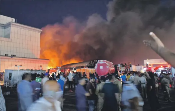  ?? AFP ?? Fire engulfs the coronaviru­s isolation ward of Al Hussein hospital in the southern Iraqi city of Nasiriyah, where there were public calls for accountabi­lity