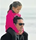  ?? Picture: EUGENE COETZEE ?? DADDY’S LITTLE PRINCESS: Lisa Julyan, 6, had a great view from her father Dave’s shoulders while watching the Something Good Surf Classic in Summerstra­nd last Saturday