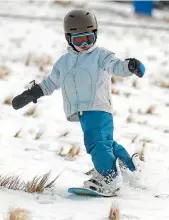  ??  ?? Roy Evans, 4, was trying out his local slopes for the first time.