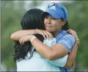  ?? AP Photo/Charles Rex Arbogast ?? Danielle Kang, right, is hugs by her mother, Grace Lee, after Kang won the Women’s PGA Championsh­ip Sunday at Olympia Fields Country Club in Olympia Fields, Ill.