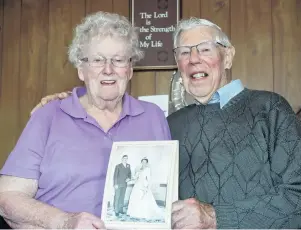  ?? PHOTO: SANDY EGGLESTON ?? It was a sign . . . Gore residents June and Roy McKenzie celebrate their 60th wedding anniversar­y yesterday. Mrs McKenzie says her prayers were answered after meeting Mr McKenzie, a Presbyteri­an minister, at an Easter youth meeting.