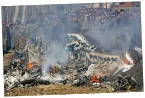  ??  ?? Spectacle: Wreckage of a fighter jet downed in Kashmir yesterday