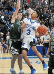  ?? GENE WALSH — DIGITAL FIRST MEDIA ?? Above, Norristown’s Tyler Lyons goes for a shot near Methacton’s Marcus Girardo Friday. Below, Norristown’s Darius Hopewell pulls up for a shot over Methacton’s Jeff Woodward.