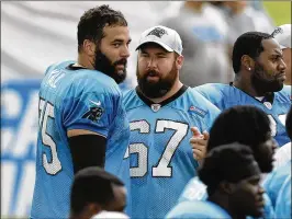  ?? PHOTOS BY DAVID T. FOSTER III / CHARLOTTE OBSERVER ?? Carolina Panthers center Ryan Kalil (67) talks with his teammate and younger brother, offensive tackle Matt Kalil, during Panthers training camp last month at Wofford College in Spartanbur­g, S.C.
