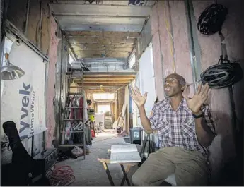  ?? Allen J. Schaben Los Angeles Times ?? OLIVER BURKE, a former Tesla motor test technician, sits in a temporary trailer on property he bought in West Oakland that a real estate co-op will transform into homes for low-income residents.