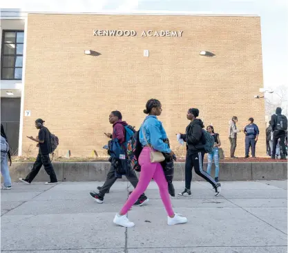  ?? TYLER PASCIAK LARIVIERE/SUN-TIMES ?? Students make their way home after being dismissed from Kenwood Academy High School in Hyde Park, which has a selective program.